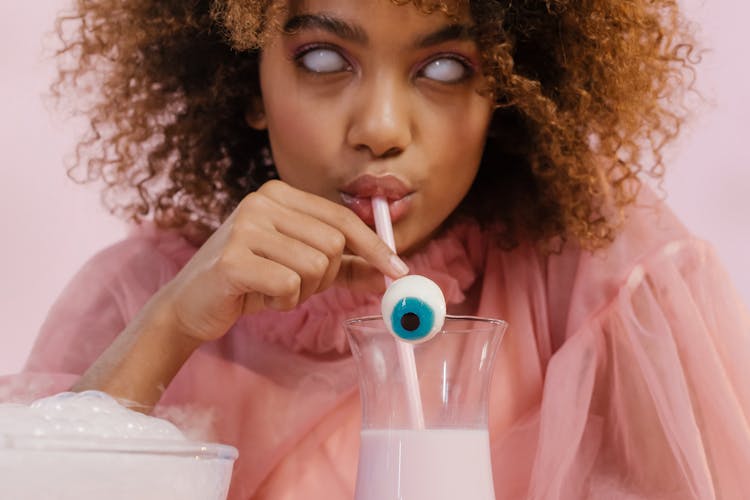 Scary Woman With White Eyes Drinking Milk