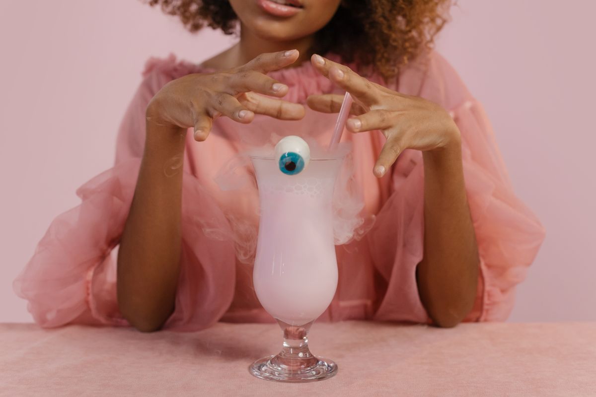 Elegant Halloween cocktail garnished with a candy eyeball, perfect for jello shots inspiration