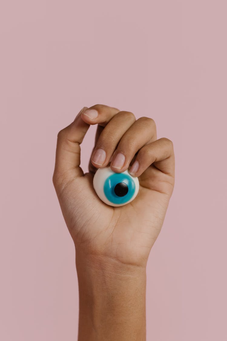 A Person Holding An Imitation Eyeball