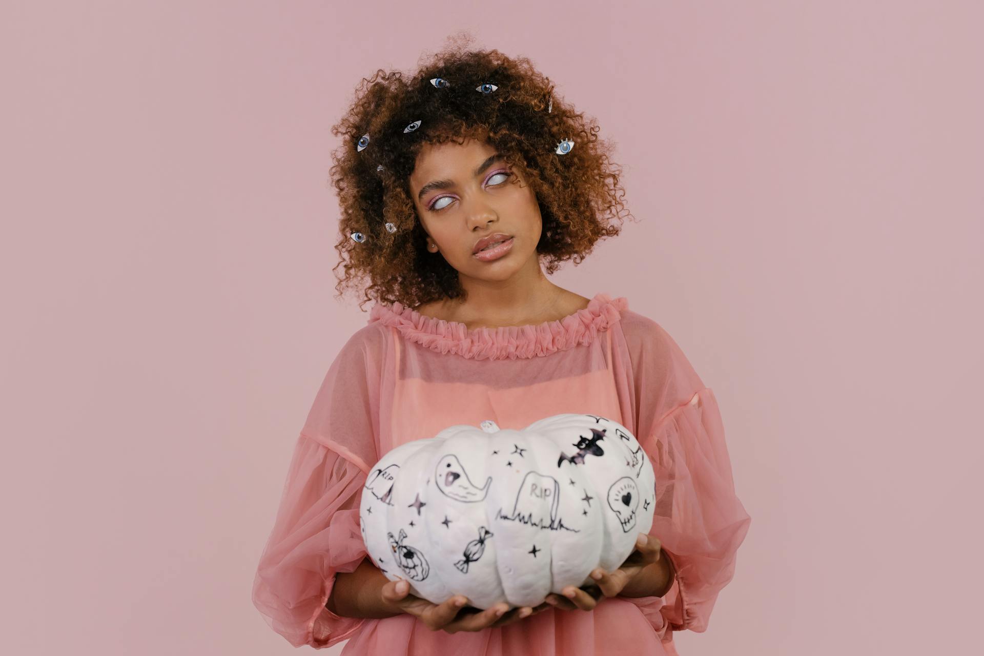 A Blind Woman Holding a White Pumpkin