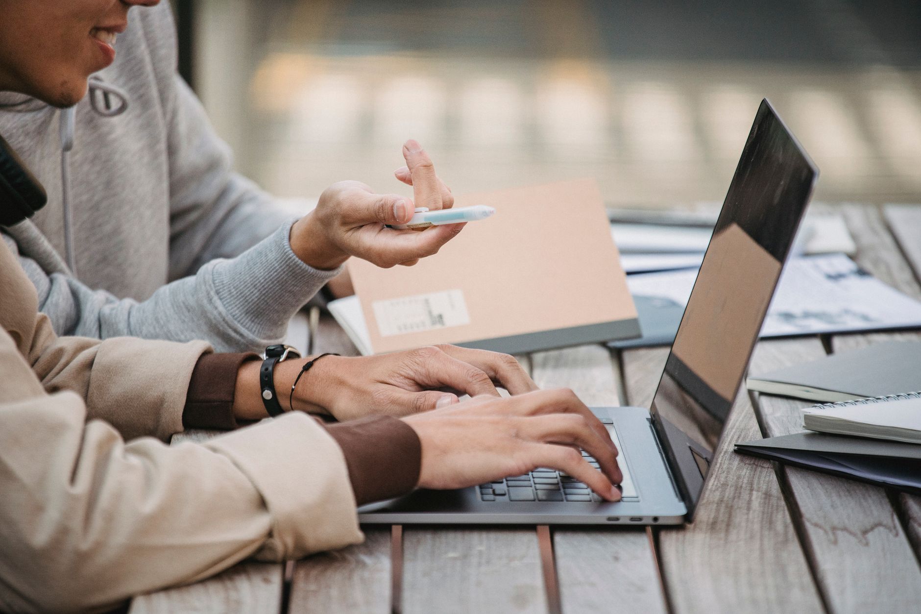 청년지원금 지급 지연 사유 3단계 점검 가이드 3 Side view of crop anonymous male students in casual wear sitting at table and typing on laptop while working together on project