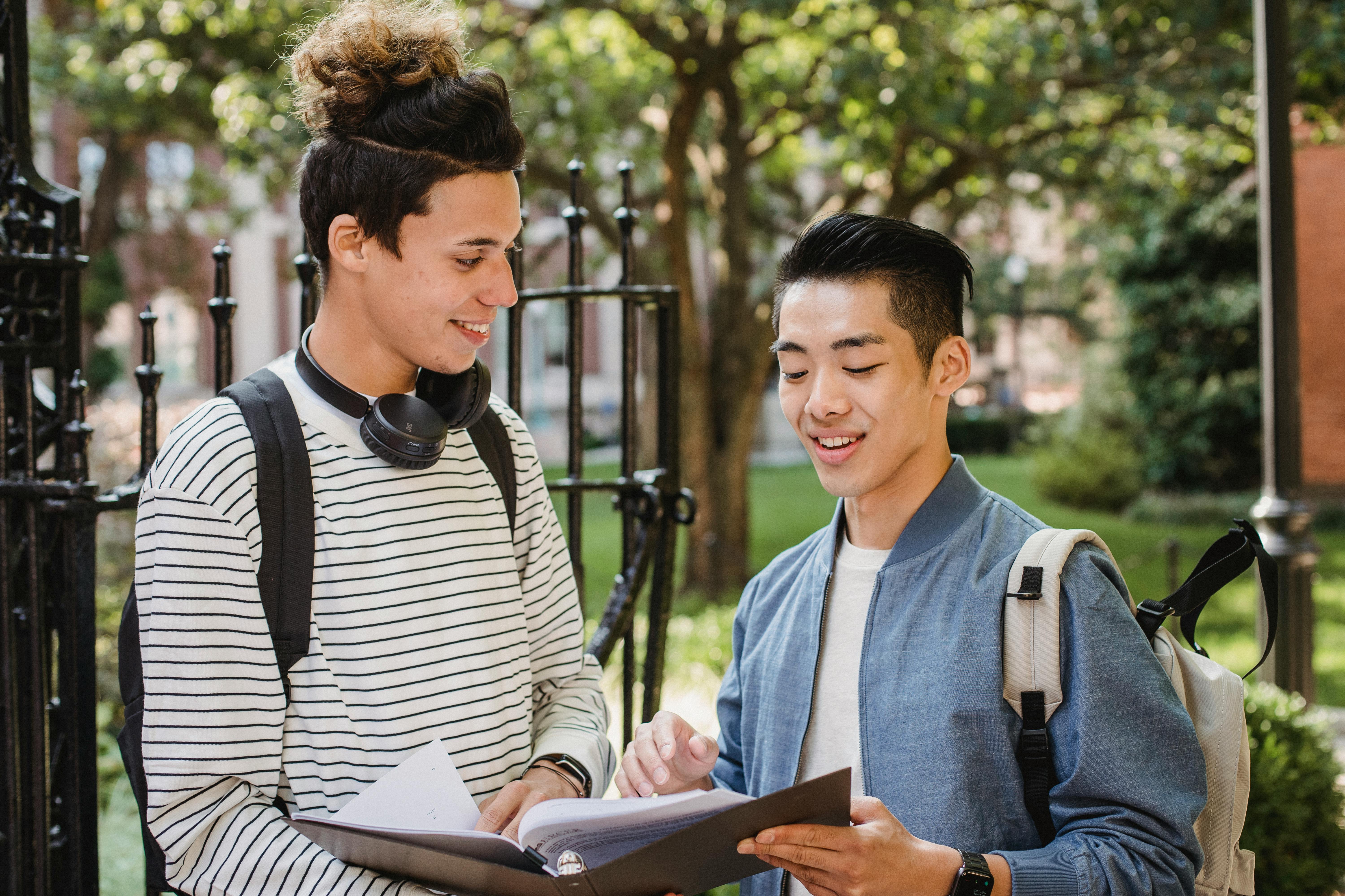 Cheerful multiethnic students sharing information about studies \u00b7 Free ...