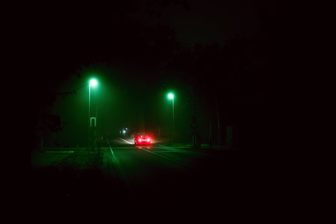 A Car on the Road at Night