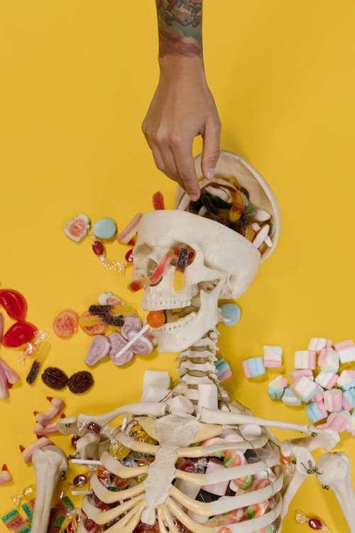 A Person Taking Candies from a Skull