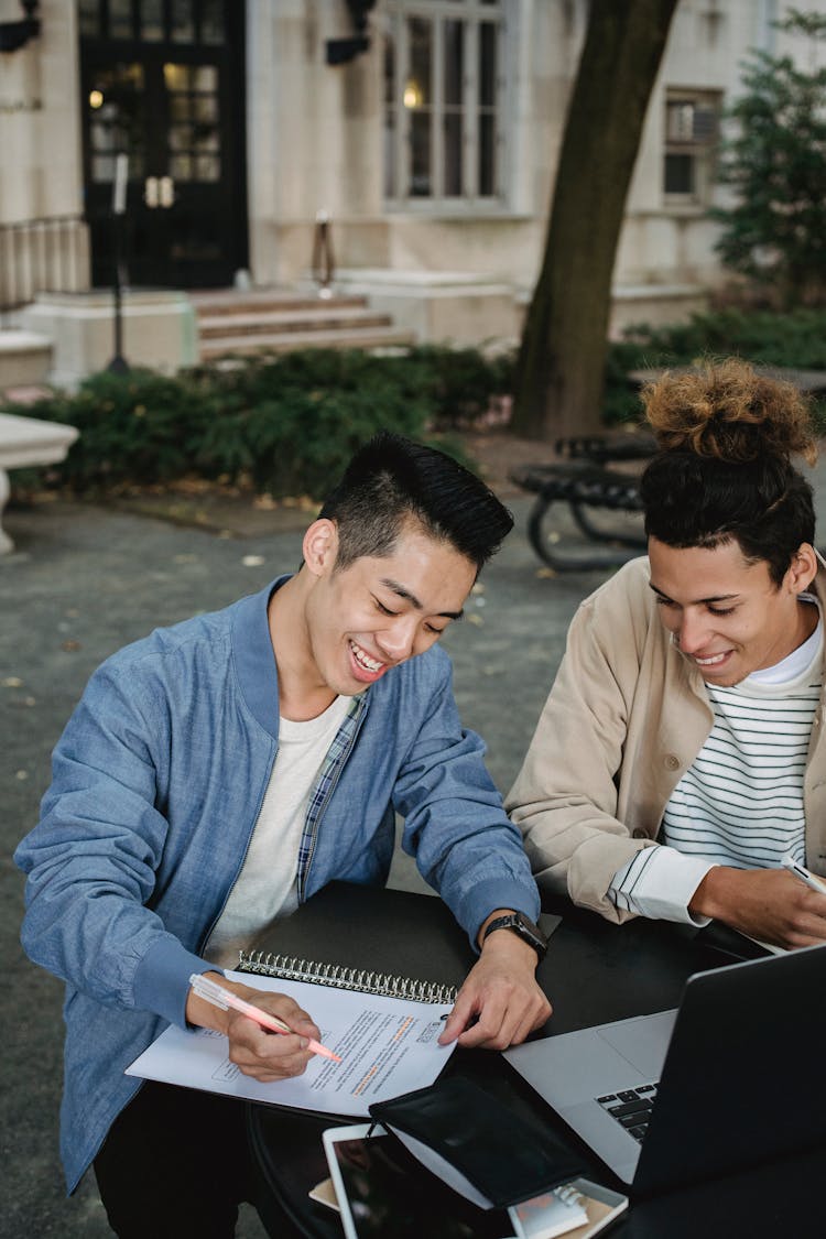 Young Men Doing School Work 