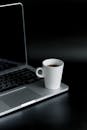 White Ceramic Mug On Macbook Pro