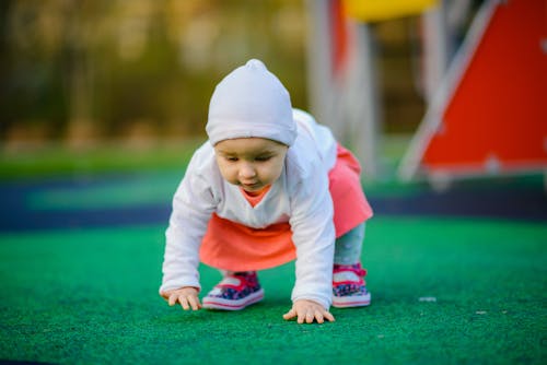 Cute little girl playing on playground