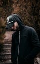 Man in Black Hoodie and Black Cap