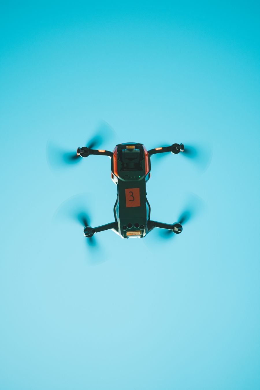 Thermal-equipped drone viewed from below in flight