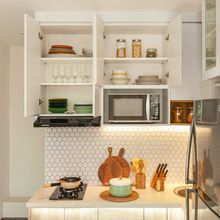 Kitchen shelving styled with ceramics, photo by Hakim Santoso on Pexels