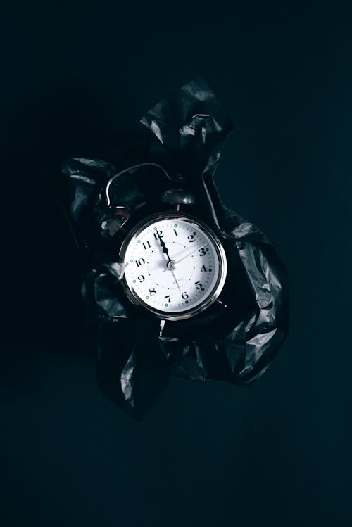 Free Alarm Clock on a Black Surface Stock Photo