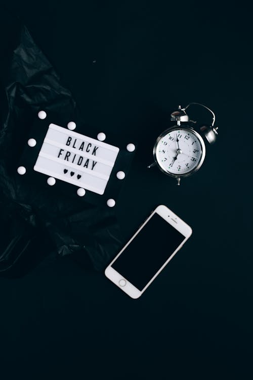 Free Black Friday Sign, Clock and Smartphone Stock Photo