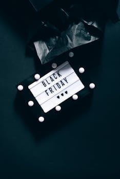 Elegant black background with Black Friday sign, perfect for shopping promotions.