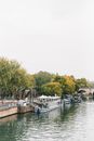 Boats on a Canal Near Green Trees