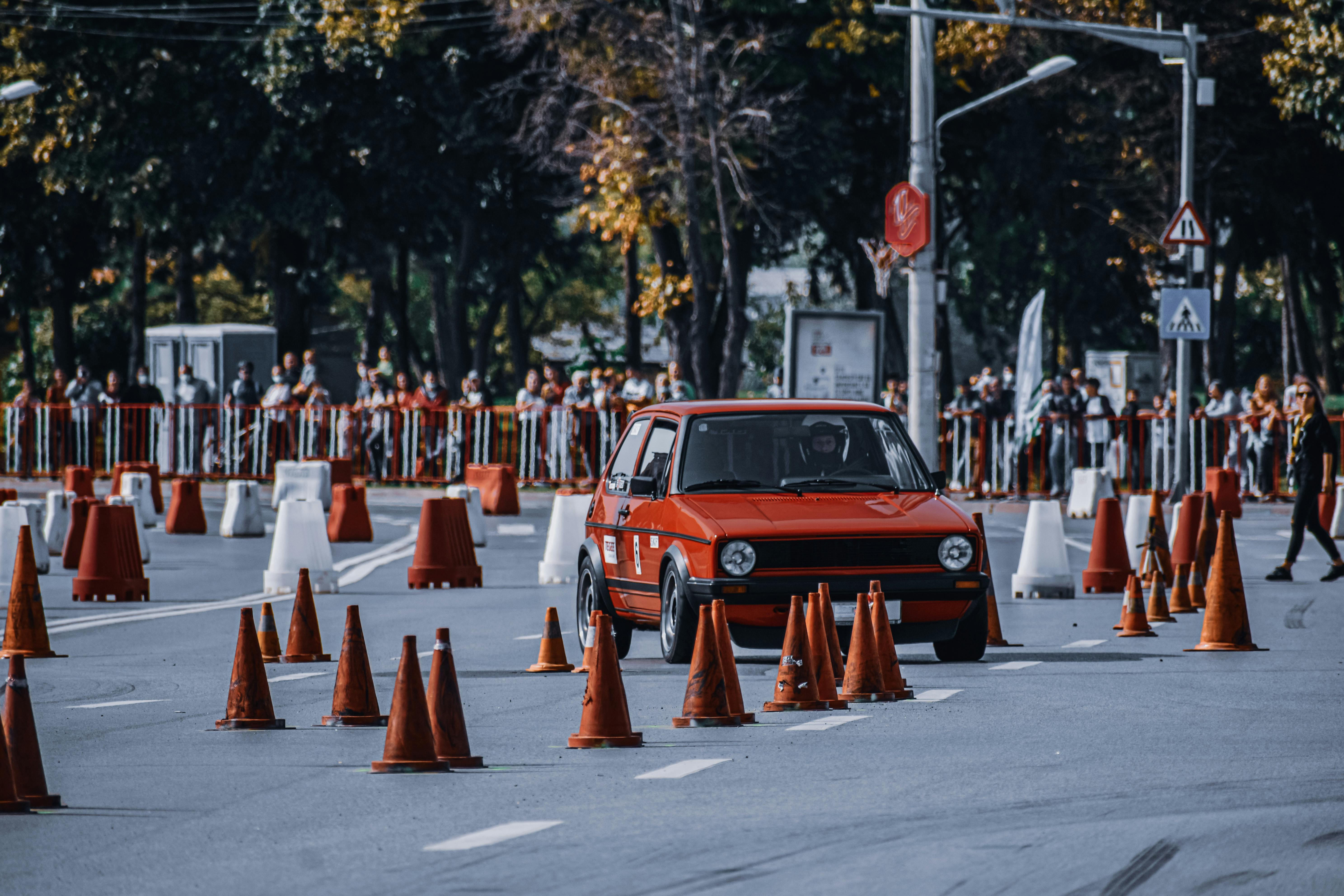 car with cone and star symbol