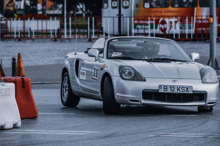 Faceless Rider Driving Car On Race