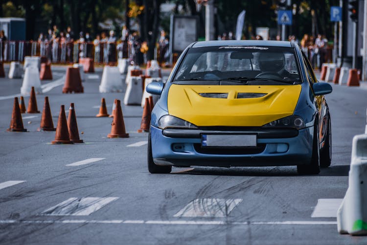 Modern Sport Car Racing On Asphalt Street In City