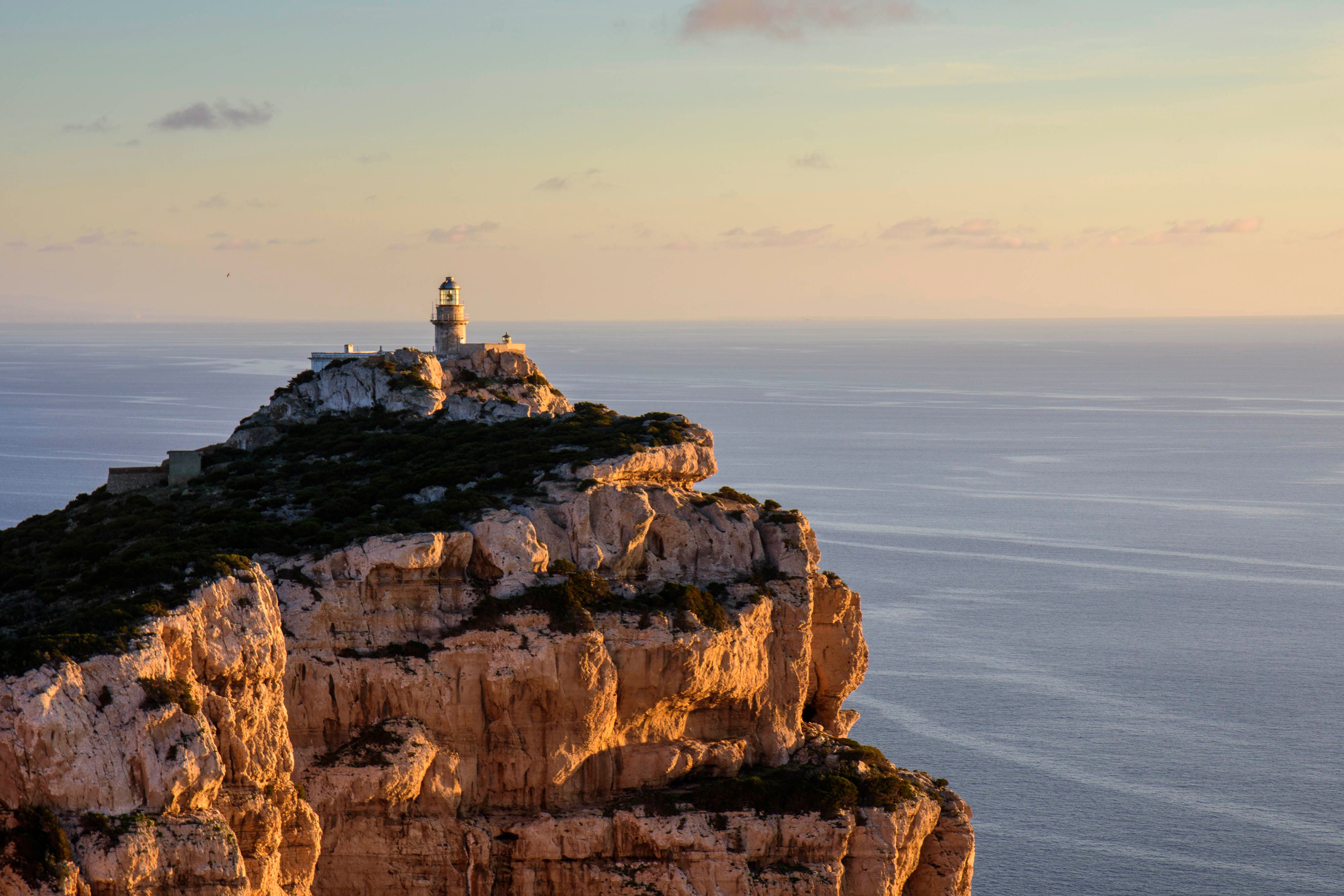 Lighthouse on Top of a Cliff · Free Stock Photo
