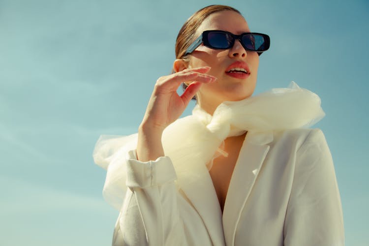 Woman In Trendy Outfit Under Sunlight