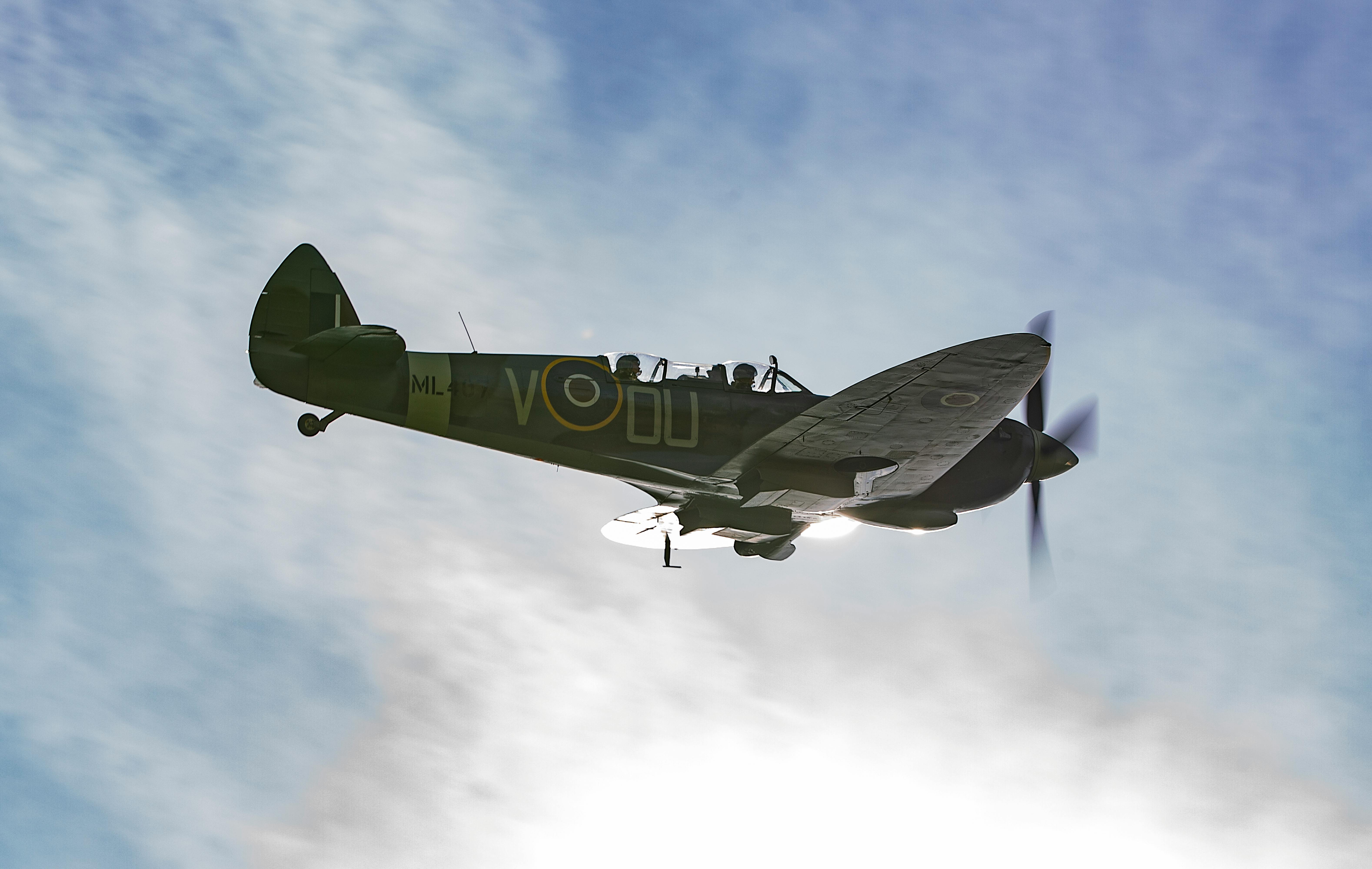 A small bowl of creamy dressing being whisked by hand