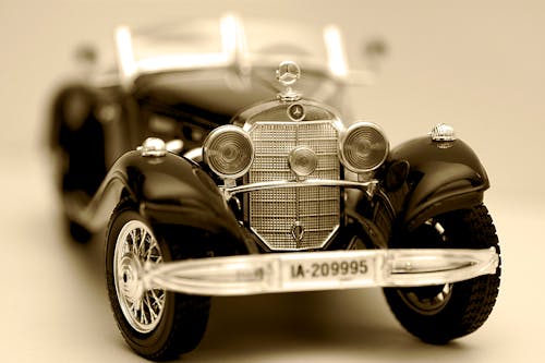 Free Selective Focus Photography of Vintage Black Car Scale Model Stock Photo