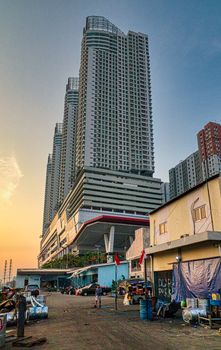 Dramatic view of Jakarta skyscrapers during sunset, showcasing urban architecture against a colorful sky. - Fotografer Sidoarjo