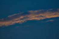 From below of white thin cirrus clouds on blue sky with wispy and silky sheen appearance in evening time in nature