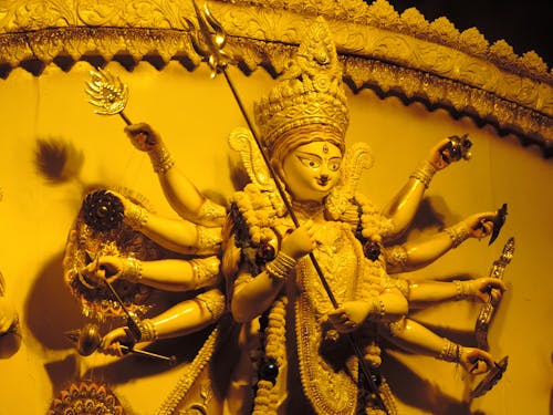 Gold Hindu Deity Figurine on Gold Frame