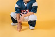 Small boy in uniform of sports player