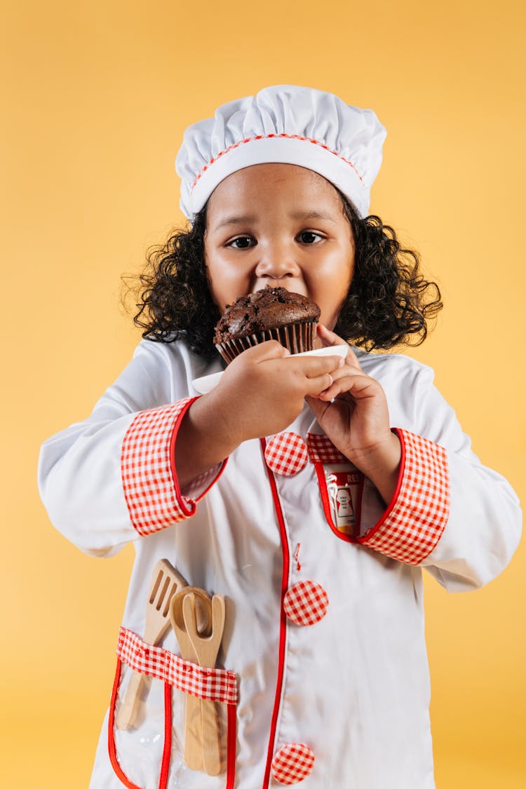 Cute Black Girl Eating Baked Muffin