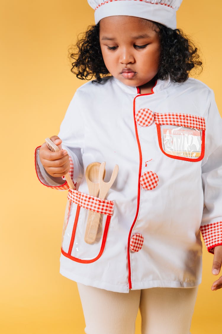 Little Black Girl Playing Chef In Studio