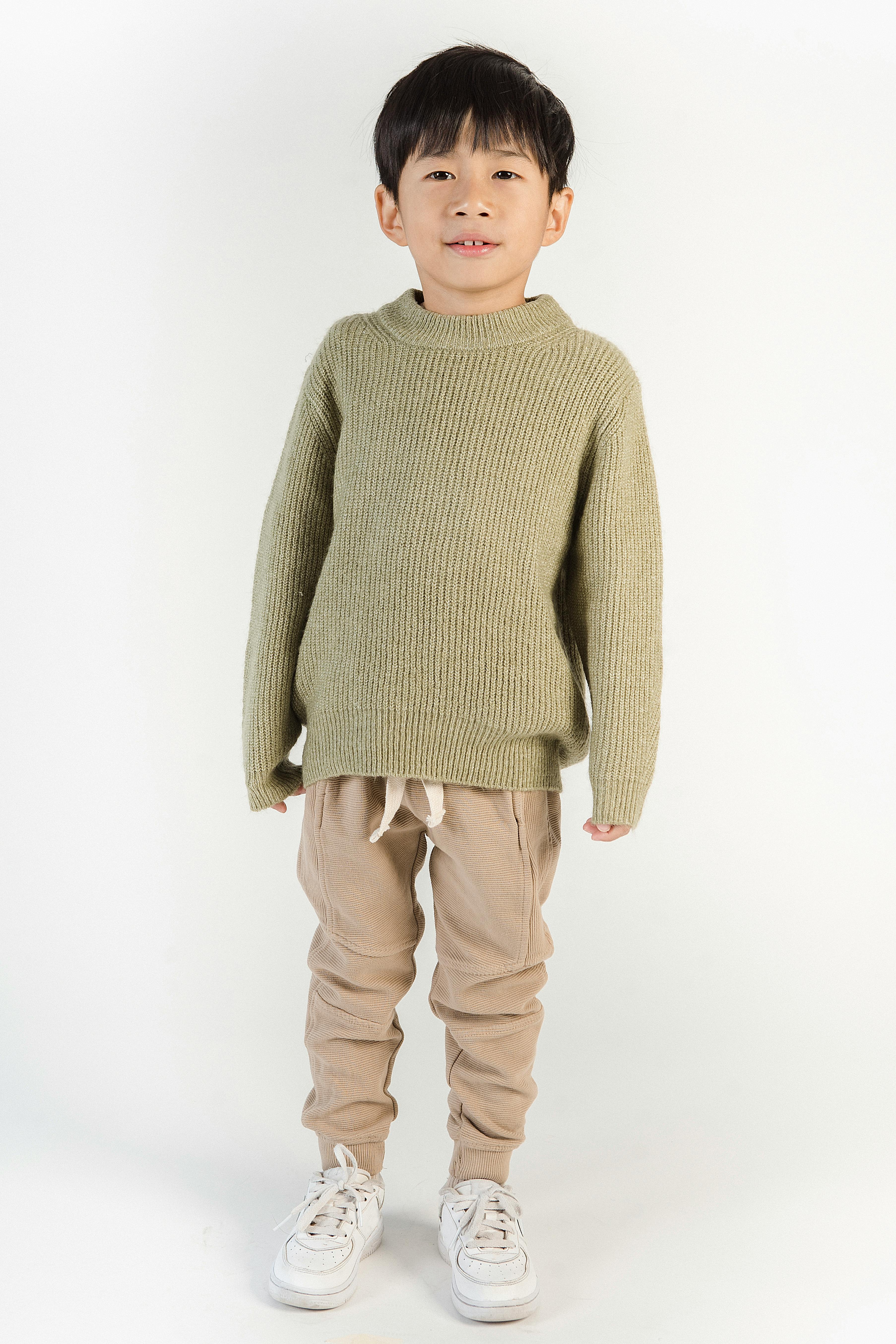 asian boy in stylish apparel on white background