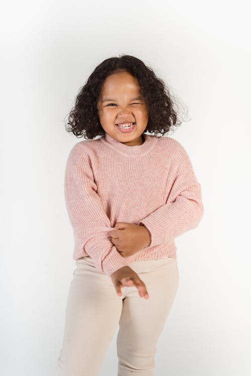 Smiling Hispanic girl in trendy outfit