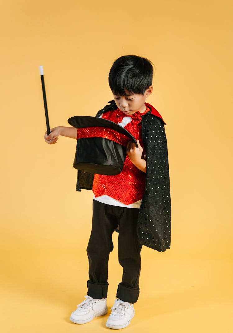 Cute Asian Boy In Magician Costume