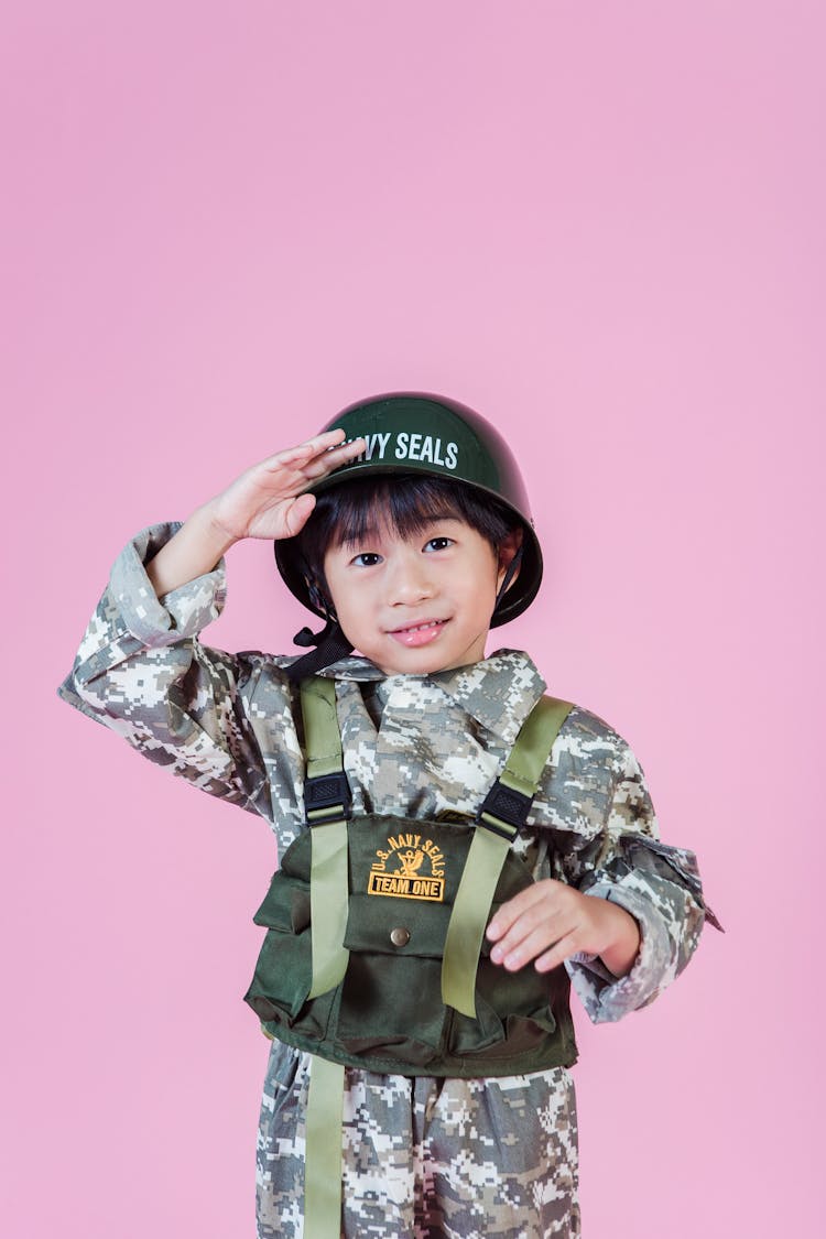 Ethnic Child In Military Outfit In Studio