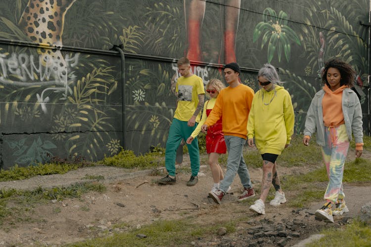 Men And Women In Stylish Clothes Walking