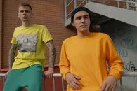 Woman in Yellow Crew Neck T-shirt Standing Beside Man in Yellow Crew Neck T-shirt
