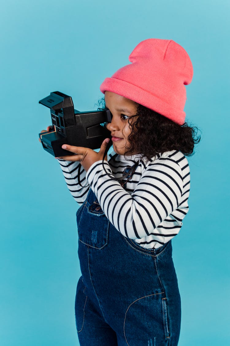 African American Girl Taking Photo On Vintage Photo Camera