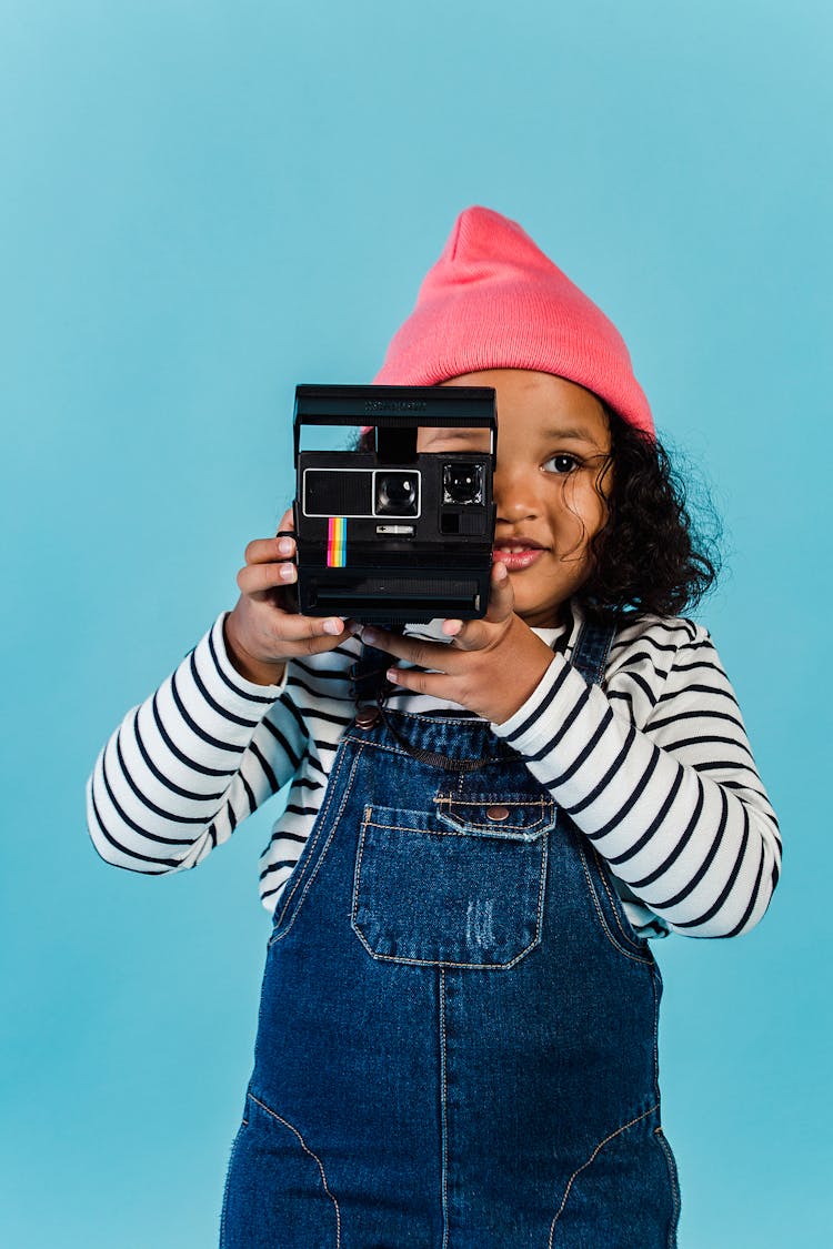 Calm Black Girl In Stylish Clothes Taking Picture On Vintage Photo Camera