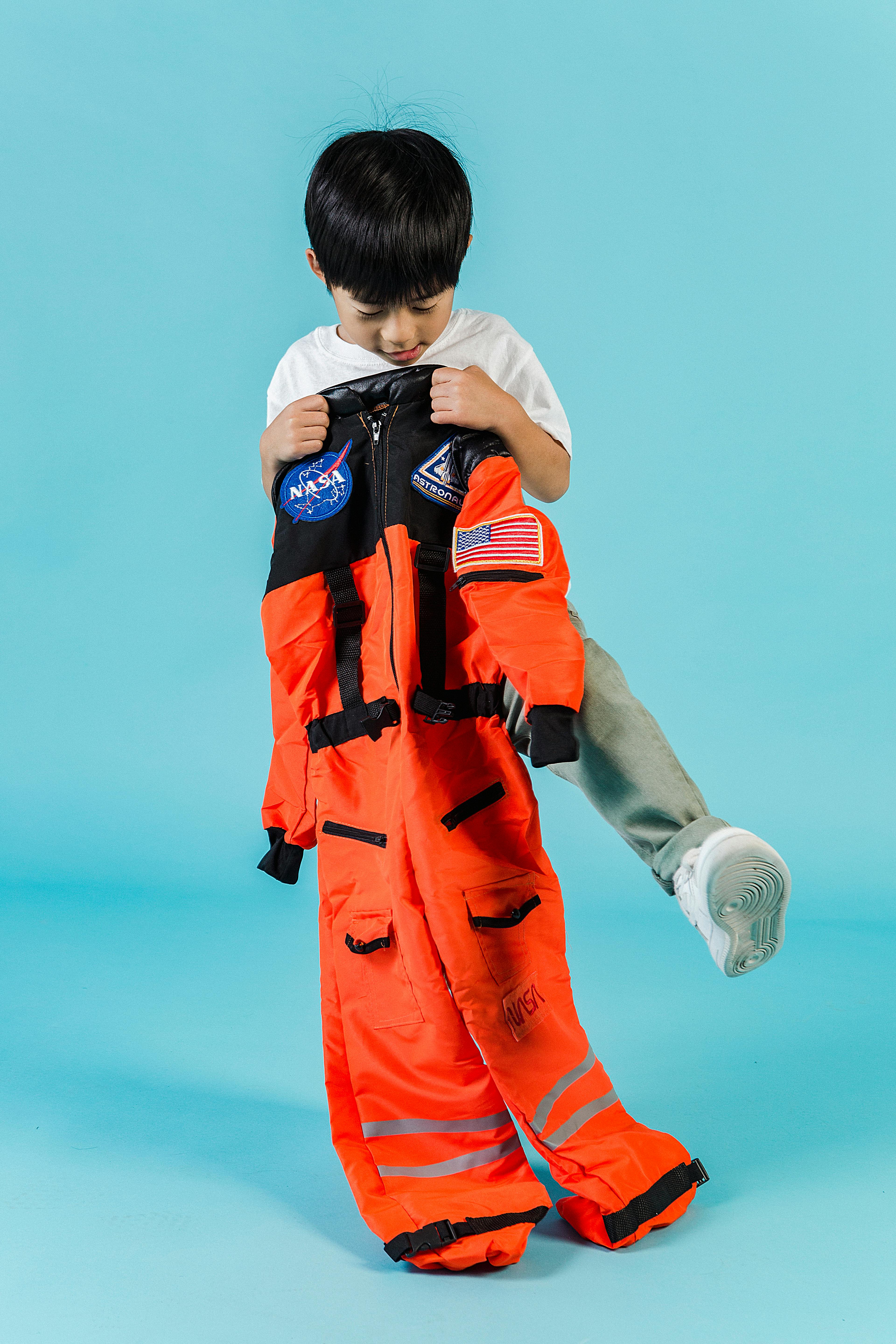 cute asian boy with cosmonaut suit