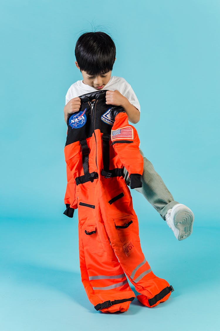 Cute Asian Boy With Cosmonaut Suit