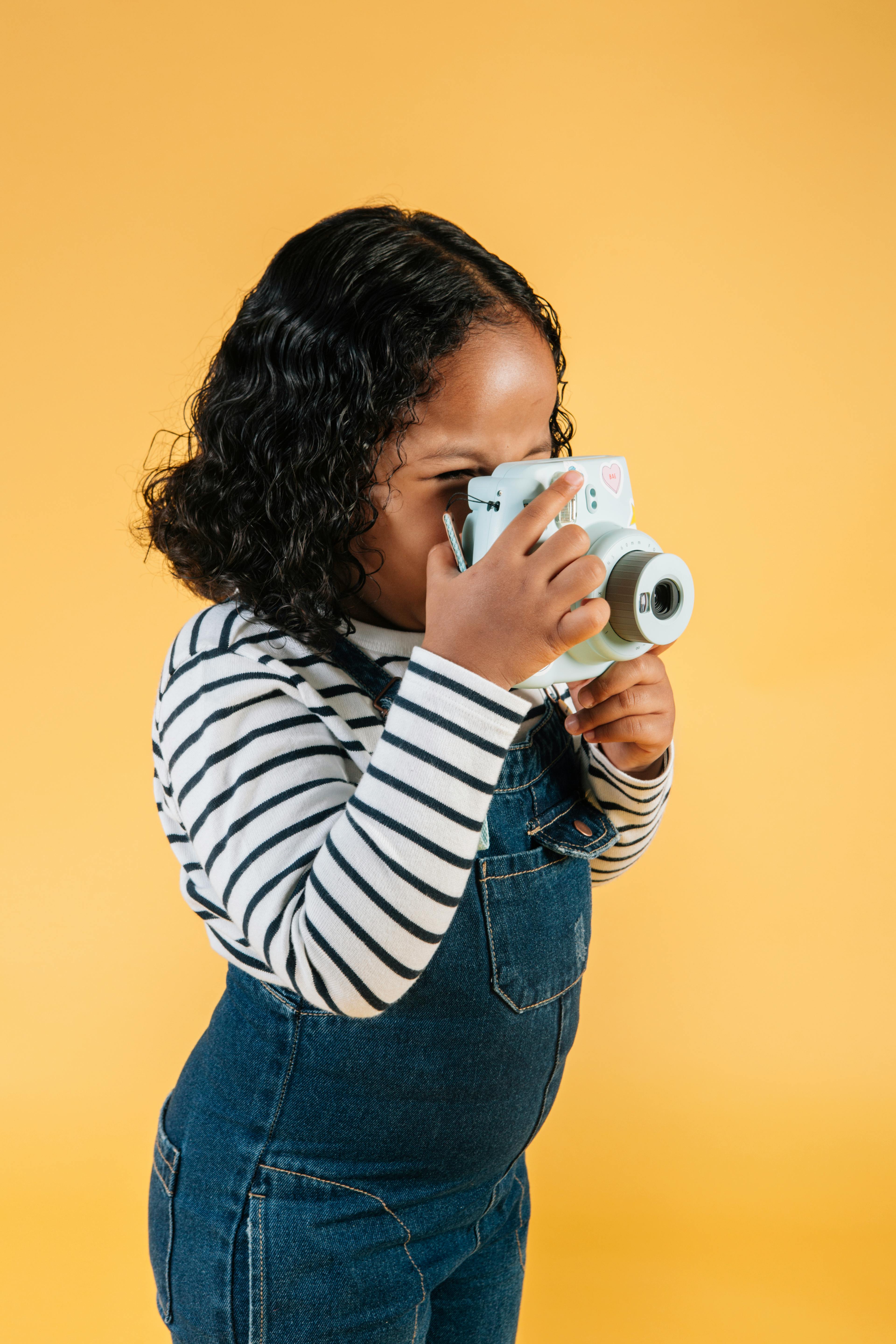 cute black girl with photo camera