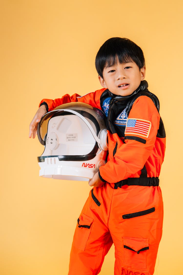 Cute Asian Boy With Astronaut Helmet
