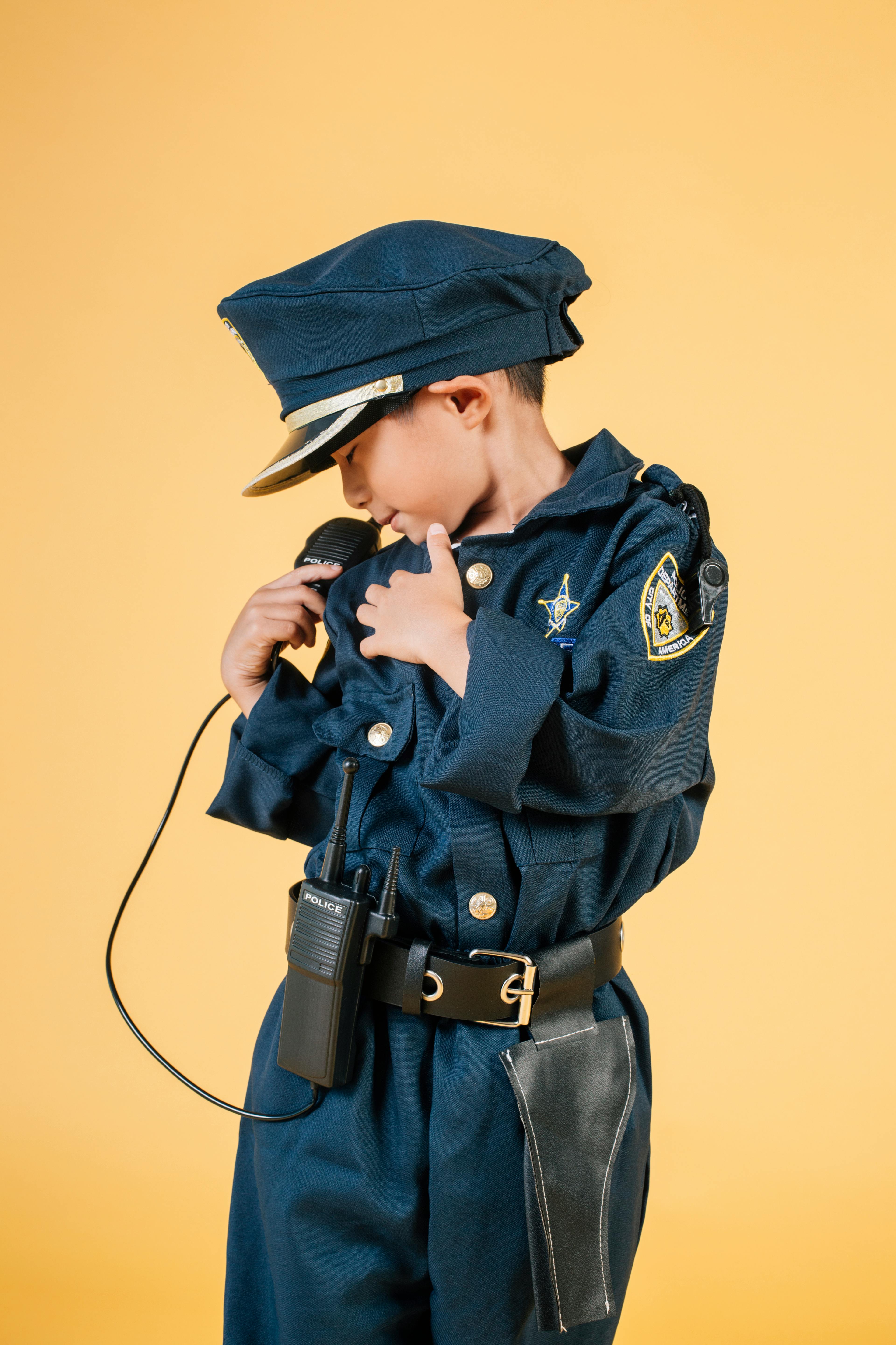 a child wearing a police uniform