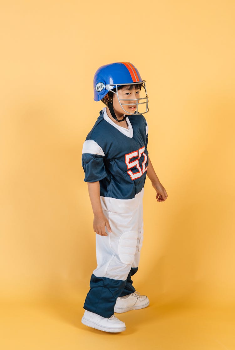 Ethnic Kid In American Football Player Costume