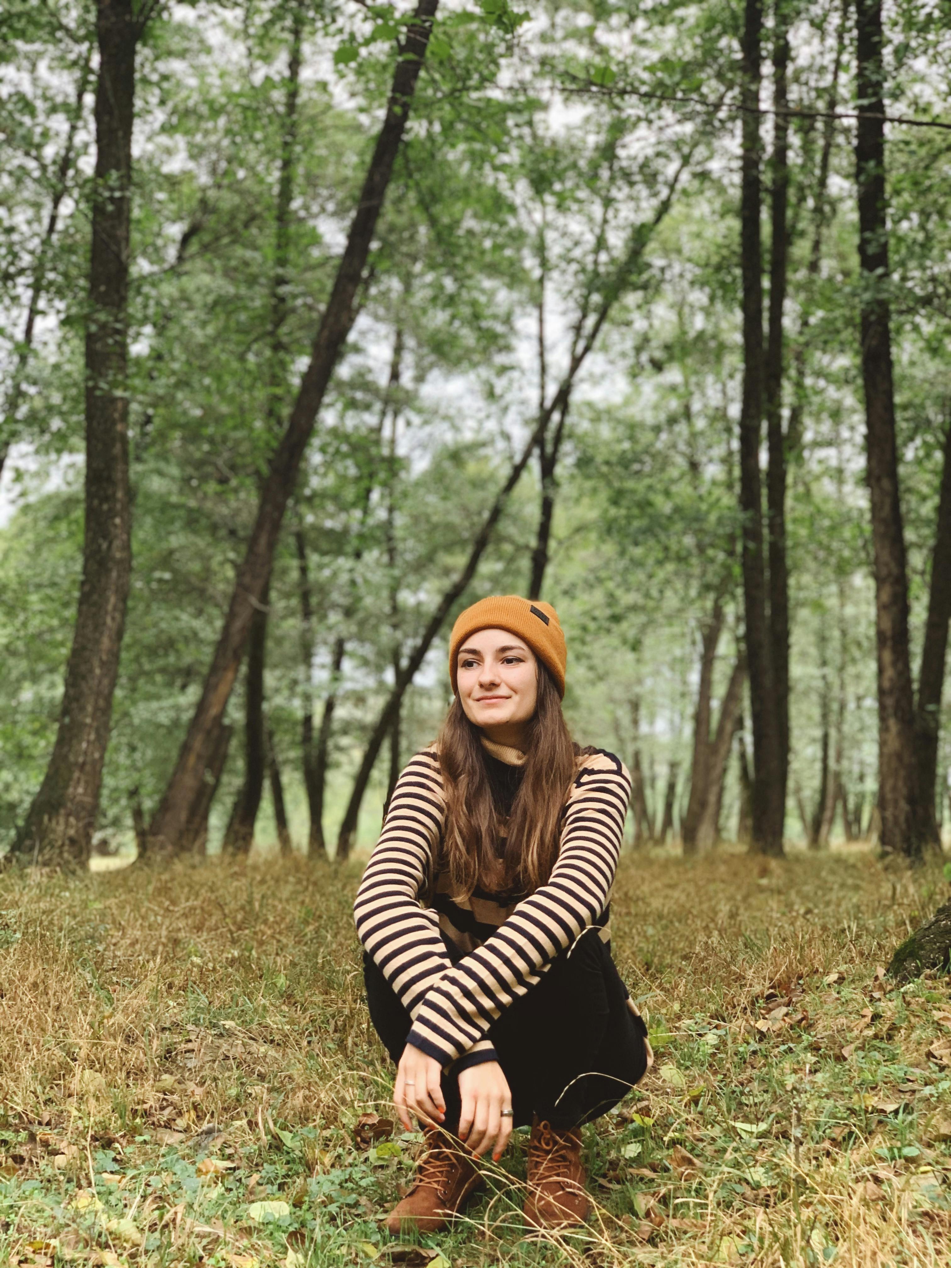 Serene woman relaxing deeply, dreamy calm expression as trance deepens in soft atmosphere