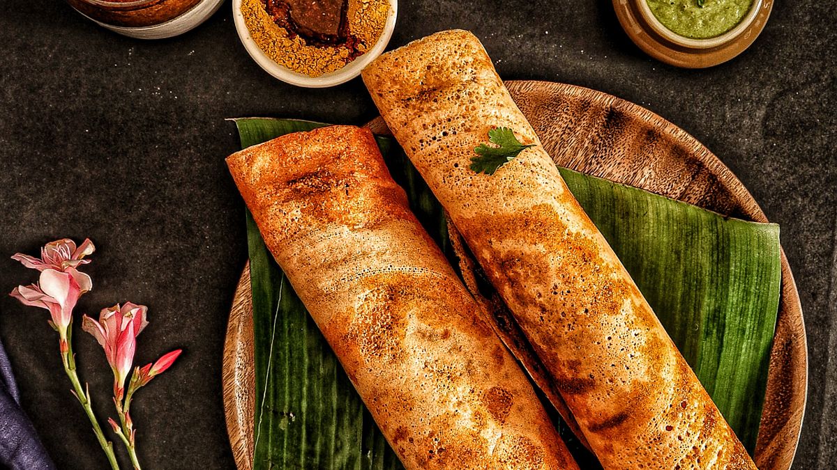 Dosa with chutneys and sambar on banana leaves (Bereavement Meal Catering in Vellore)