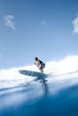 Man surfing on blue sea water