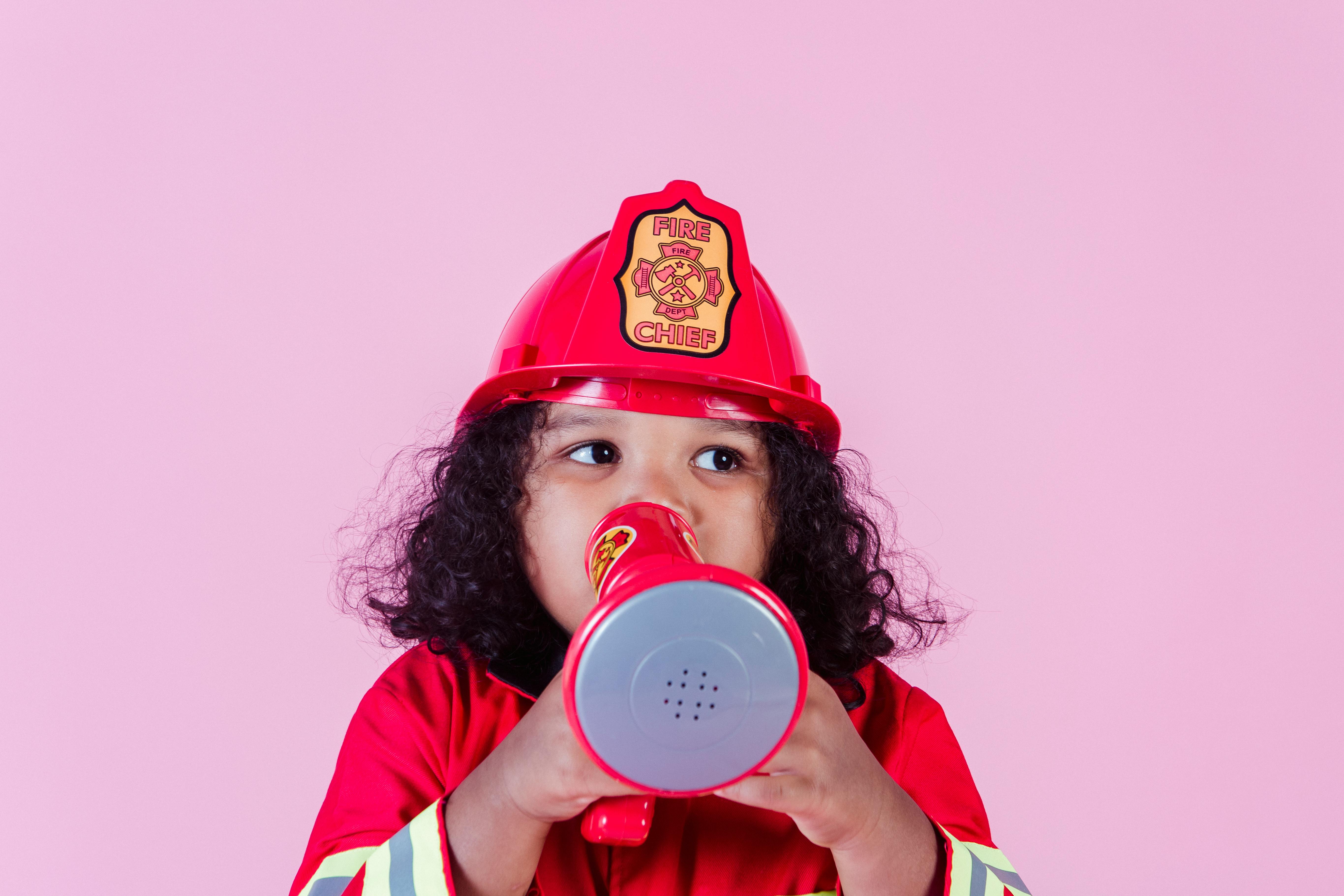 adorable black girl wearing firefighter costume