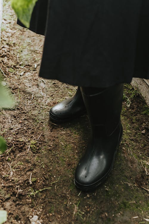 Person Wearing Rubber Boots
